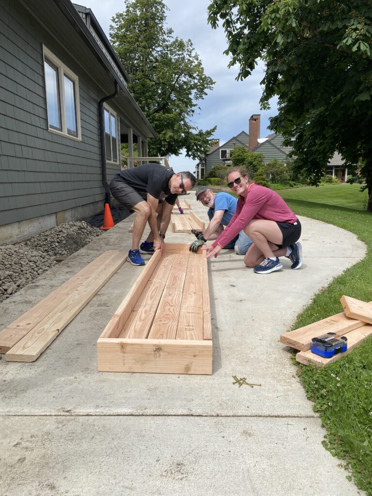 Volunteers building planter boxes